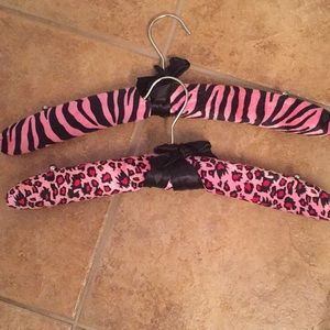 2 padded animal print clothes hangers.